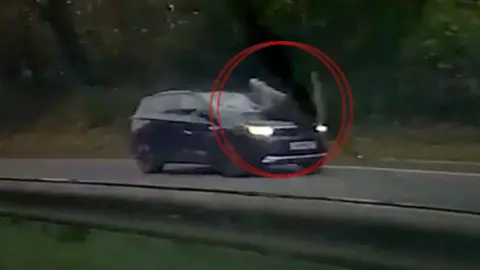 A man was filmed hanging on to the bonnet of the A48 dual carriageway in Cardiff