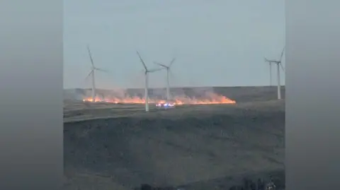 Carl Greenhalgh Fire near wind turbines on Scout Moor
