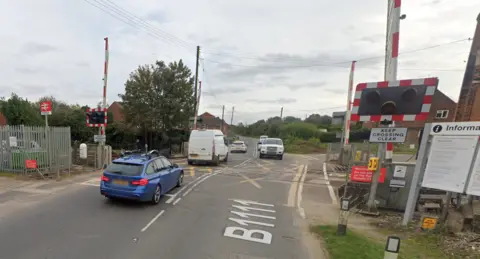 Google  Railway level crossing at Harling Road