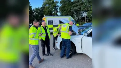 City of Wolverhampton College Officers inspect seized limousine