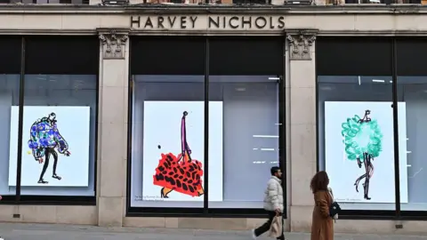 Getty Images People walking past a luxury department store in Knightsbidge, London 