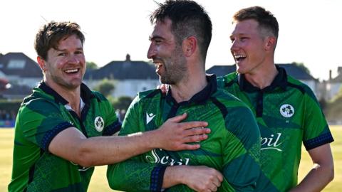 Balbirnie is congratulated by team-mates Barry McCarthy (left) and Harry Tector (right) after the team's dramatic win in Dublin