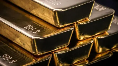 Bars of gold stacked on top of each other