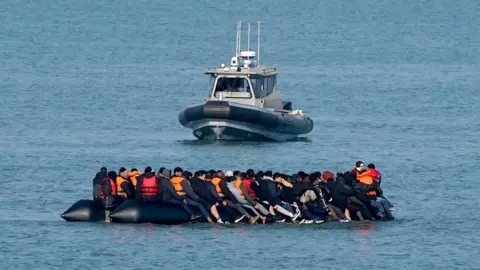 People thought to be migrants onboard a small boat in Gravelines, France, during an attempt to cross the Channel. Picture date: Tuesday March 3, 2026.