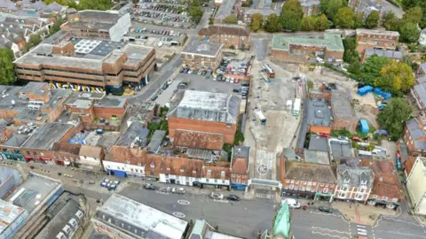 A bird's eye view of part of central Winchester, including the city's bus station, Friarsgate car park and the Kings Walk block. 