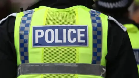 The back of a police officer 