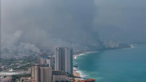 Shutterstock Plumes of smoke rise from Puerto Vallarta