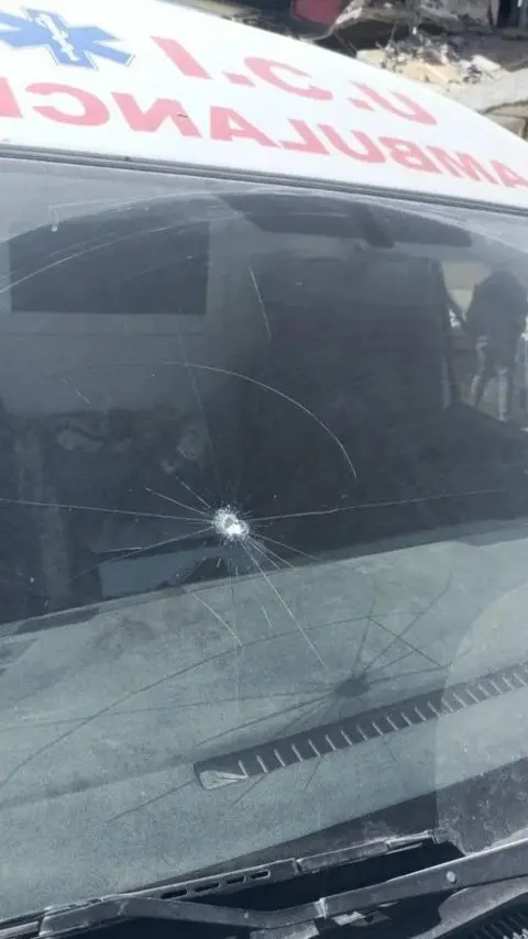 Supplied Ambulance windscreen damaged by a bullet, reportedly fired by Israeli forces, in northern Gaza