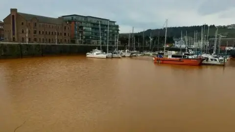 Whitehaven Harbour Commissioners A general view of Whitehaven Harbour with brown water surrounding the boats