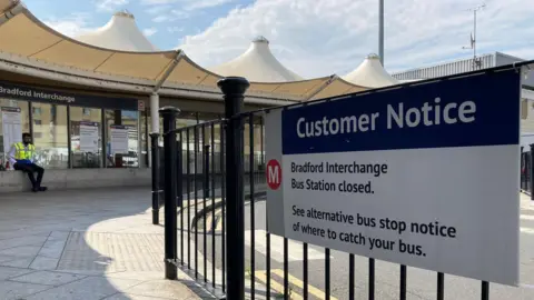 A sign saying Bradford Interchange's bus station remains closed