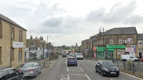 Google street view of Westbourne Rd it is lined with shops and and a cafe 