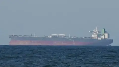 Screengrab of a file image showing a ship with a red base in water.