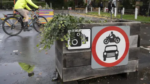 Getty Images LTN box and a cyclist going past