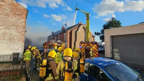 Cheshire Fire & Rescue Service Firefighters working to tackle the blaze at Catherine Street in Crewe