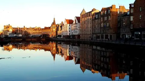 The shore of Leith reflected in the water