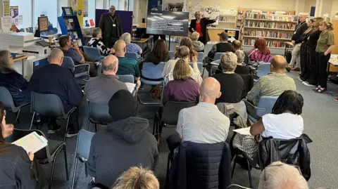Councillor Janine Howarth delivering a presentation in front of tenants at the first of four consultation events.