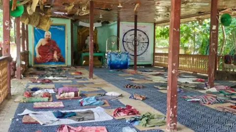 Mats and rugs can be seen on the floor of an open-walled space for meditation
