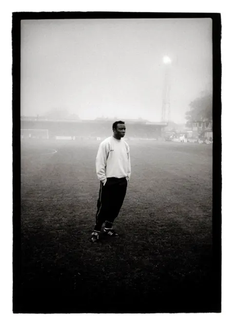 Marcus Davies Torquay United's promotion winning manager Leroy Rosenior standing in the fog in 2005