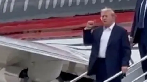 Trump steps off plane in Milwaukee for convention