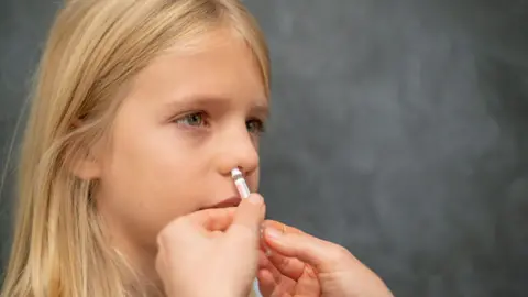 Child getting vaccinated against the flu