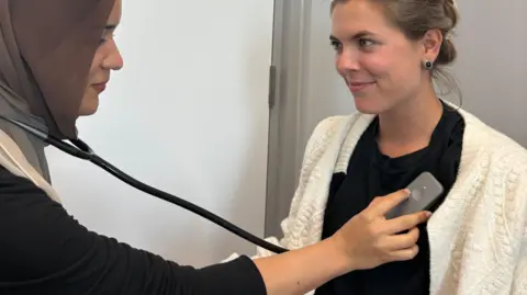 PA Media Undated handout photo issued by Imperial College London of an AI-powered stethoscope in use.
