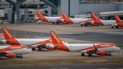 Getty Images Easyjet planes on the tarmac at Gatwick airport.