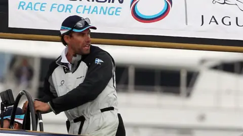 Getty Images The skipper of TeamOrigin Ben Ainslie sails against the American team's BMW Oracle in the America's Cup Race at the Cowes Week Regatta 2010 
