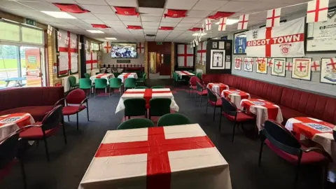 Didcot Town FC Flags inside a clubhouse at Didcot Town football club.