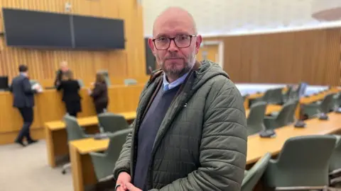 Georgia Roberts/BBC Image of Steve Hassell at a city council meeting