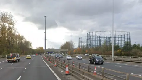 Google Cars and trucks travel along the M8 motorway