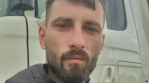 Facebook A man with brown hair and a short beard