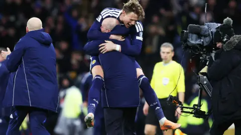 Scotland's Scott McTominay and Steve Clarke celebrate
