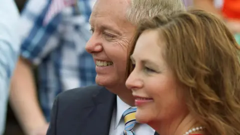 Graham and Nordone seen standing together and smiling