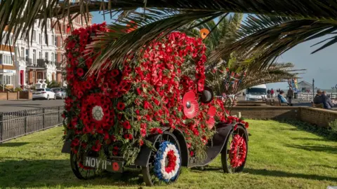 Jeff Penfold Replica vintage car covered in poppies
