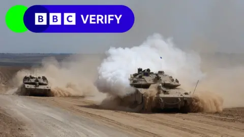 EPA Israeli armoured fighting vehicles make their way to the northern Gaza Strip