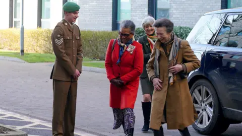 PA Media Princess Anne exiting a car at Southmead Hospital on her way to meet staff who provided her care