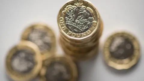 PA Media Pound coins piled up