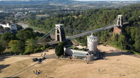 Reuters A drone view of the Clifton Suspension Bridge showing the Clifton Observatory. The grass around the Observatory is completely parched and brown