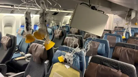 Interior of Singapore Airlines flight SQ32 after an emergency landing. 
