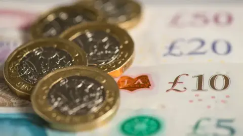 BBC Picture of pound coins and notes of various denominations
