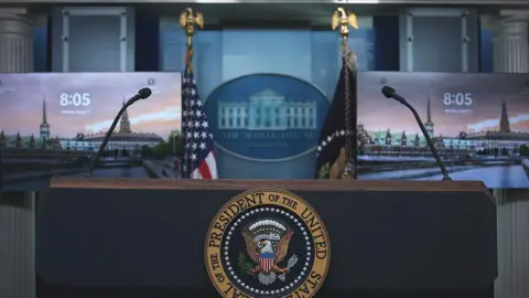 The US Presidential seal on the podium in James Brady Press Briefing Room at the White House, ahead of President Donald Trump's presser, Monday, Aug. 11, 2025, in Washington, D.C.

