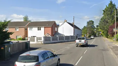 Google A google street view of the A361 near Southwick in Wiltshire with cars on the road and buildings either side