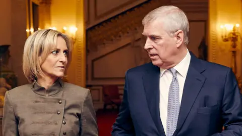 Emily Maitlis (left) and Prince Andrew (right) look at each other as they walk side by side through a palace hallway