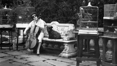 Beatrice Harrison pictured in her garden in August 1926