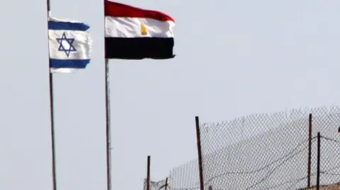 Israel and Egyptian flags at Taba crossing (file photo)