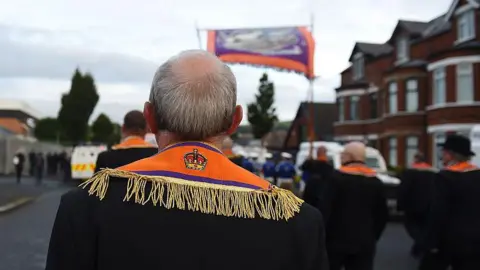 Getty Images Back view of Orangemen marching