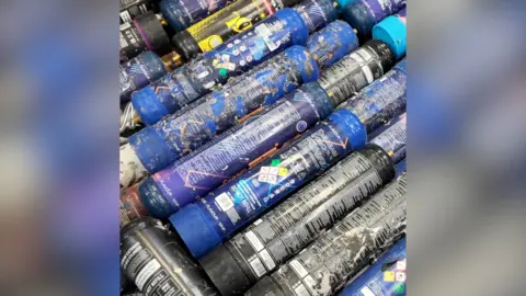 A pile of used gas canisters