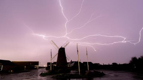 Lightning strikes near a windmill in West Sussex