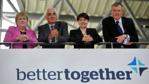 Getty Images Scottish Labour leader Johann Lamont, Better Together chairman Alistair Darling, Scottish Conservative leader Ruth Davidson and Scottish LibDem leader Willie Rennie leaning over a Better Together sign