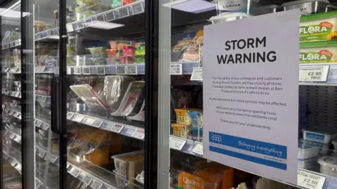 A storm warning side detailing closures on a fridge in a supermarket. 